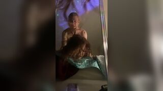 Moaning and rolling her eyes for pleasure