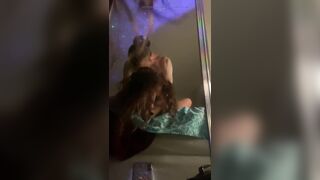 Moaning and rolling her eyes for pleasure