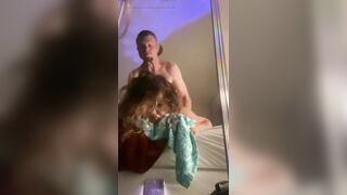 Moaning and rolling her eyes for pleasure