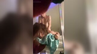 Moaning and rolling her eyes for pleasure