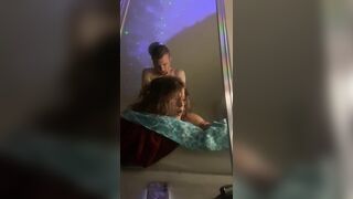 Moaning and rolling her eyes for pleasure