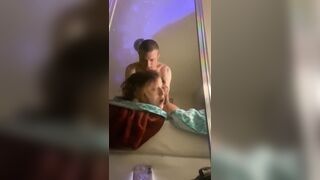 Moaning and rolling her eyes for pleasure